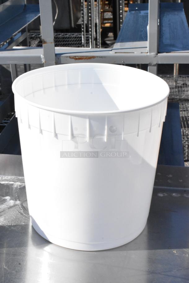 White Poly 9.5 Liter Bin, lightly scratched or dented, shown on metal shelf. Sold in bulk, 44 bins per bid.