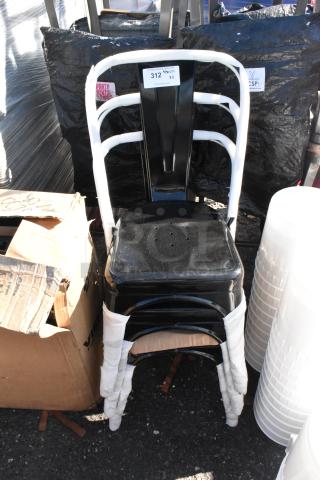 Black metal Tolix style dining chair, dining height, stack of three, new with minor scratches, labeled "312 Qty x3."