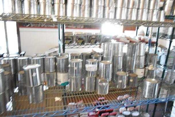 54 cans of Pro Guard chemicals on shelves, featuring liquid roof sealant and moisture cure liquid rubber. Sold as a lot.