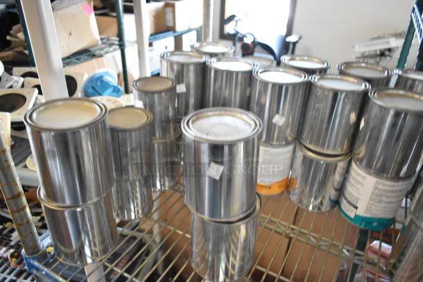 54 cans of Pro Guard Chemicals, including liquid roof sealant and moisture cure liquid rubber, on metal shelf.