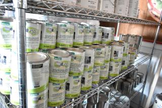 143 Pro Guard chemicals, including White Pour N Plug cans, displayed on shelving. Marked as moisture curing leak stopper.
