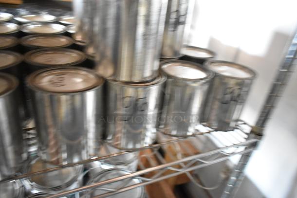 107 Pro Guard chemical cans on metal shelf, some labeled "Gray." Auction lot includes varied chemicals, bid multiplied by 107.