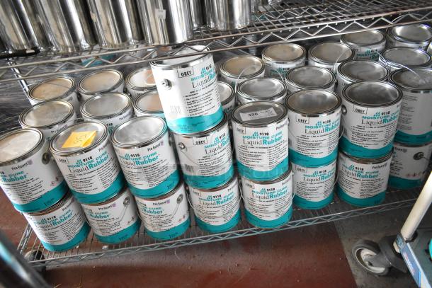 55 cans of Pro Guard 9118 Moisture Cure Liquid Rubber on metal shelving. Labels show product details and grey color.
