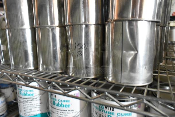 86 Pro Guard chemical cans, including 1501 Part B and 9201K Pour N Plug, in metallic containers, on a shelf.