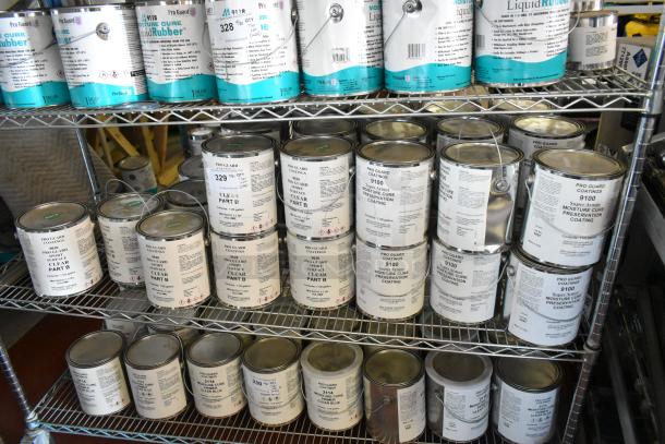 35 Pro Guard chemicals on shelves, including 9620 Sport Surface Clear Part B, 9100 Moisture Cure Coating. Good condition.