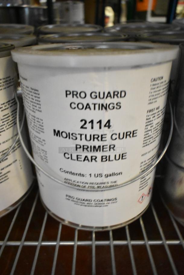 Bucket of Pro Guard Coatings 2114 Moisture Cure Primer, Clear Blue, 1 US gallon, metal handle, visible labeling.