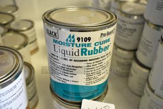 Pro Guard 9109 Black Moisture Cure Liquid Rubber can, part of a lot of 5 various Pro Guard chemicals, shown in focus.