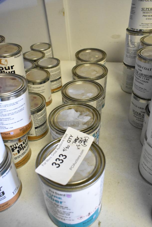 Five cans of Pro Guard Chemicals, including 9109 Black Moisture Cure Liquid Rubber, with auction label for lot 333.