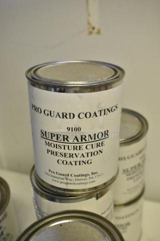 18 cans of Pro Guard Coatings, including 9100 Super Armor Moisture Cure Preservation Coating, labeled and stacked.