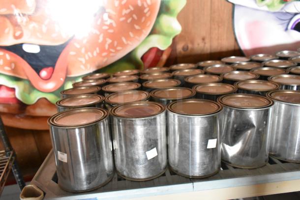 89 Pro Guard chemical cans on a shelf, each with a metal finish and sealed lids. Some show minor dents. Numbered stickers visible.