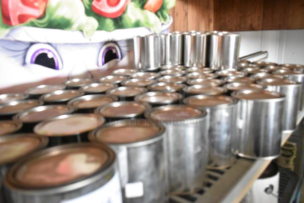 89 Pro Guard chemical cans stacked on a shelf, all sealed and in new condition.