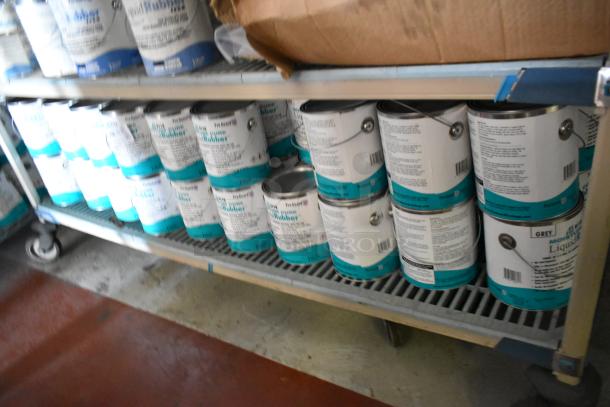 Shelf of 53 Pro Guard chemicals, including 9118 Moisture Cure Liquid Rubber cans, stored in a well-lit area.