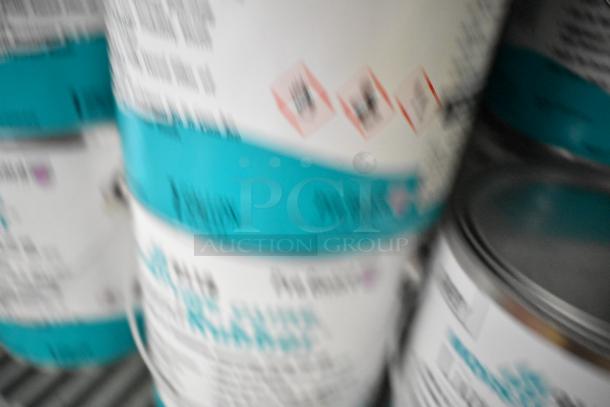 Blurry image of Pro Guard chemical cans including 9118 Moisture Cure Liquid Rubber, labeled with safety icons.