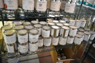 56 Pro Guard chemical cans on metal shelves, including 9100 Super Armor and 2114 Primer. Refillable condition.