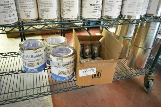 24 Pro Guard chemical cans, including Gray Liquid Rubber EPDM, displayed on shelves.