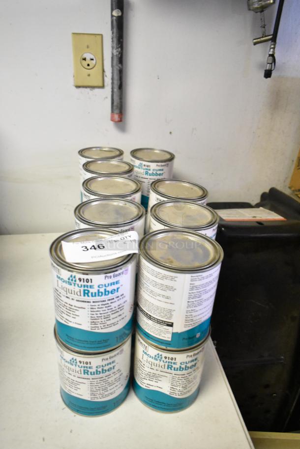 19 cans of Pro Guard 9101 Moisture Cure Liquid Rubber, neatly stacked, labeled for auction, enhance bid value.