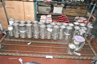 56 various Pro Guard chemicals, including ProFlex 1501 Part B epoxy, in metal cans on a shelf. Auction lot.