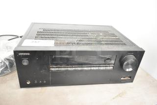 Onkyo TX-SR373 AV receiver, black, front panel buttons, volume knob, minor surface wear, model label visible.