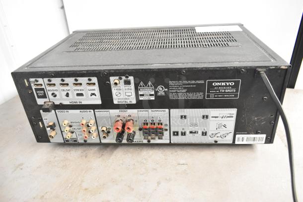 Onkyo TX-SR373 AV Receiver, rear view showing HDMI, audio inputs, speaker connections, and model label. Minor wear visible.