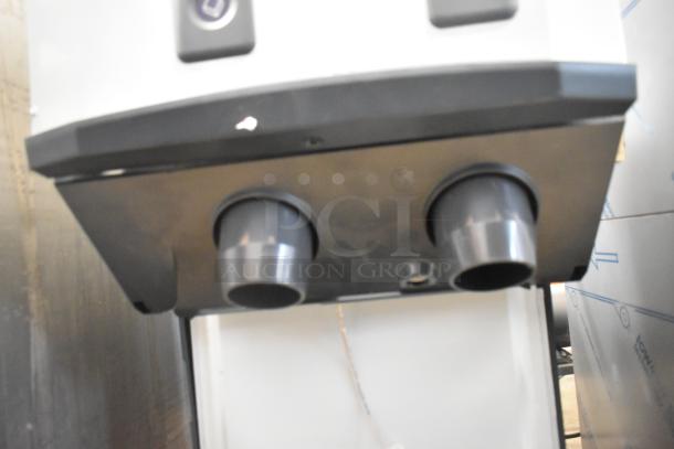 BRAND NEW Scotsman HID312AB-1A countertop ice machine and water dispenser. Stainless steel, 12 lb bin, push button dispense. Slight scratches visible.