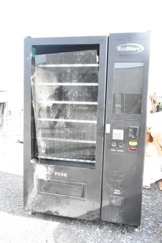 BRAND NEW KoolMore KM-VMNT-50-BR vending machine, 60 slots, visible scratches and dents, non-refrigerated, black finish.