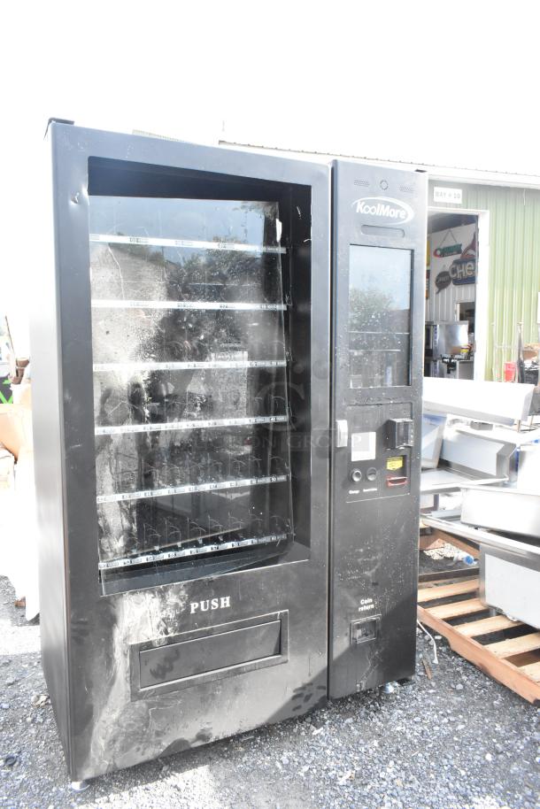 BRAND NEW SCRATCH AND DENT KoolMore KM-VMNT-50-BR vending machine, 60 slots, non-refrigerated, visible scratches on exterior.