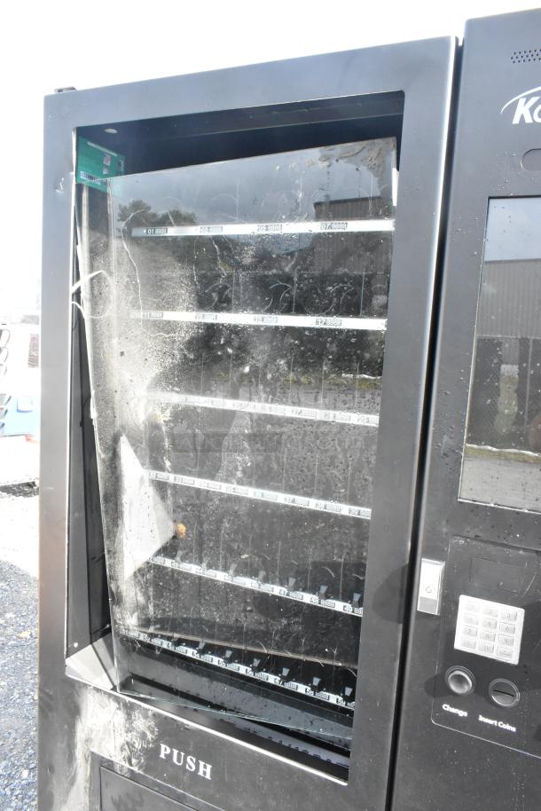 KoolMore KM-VMNT-50-BR non-refrigerated vending machine with 60 slots. Brand new scratch and dent condition.