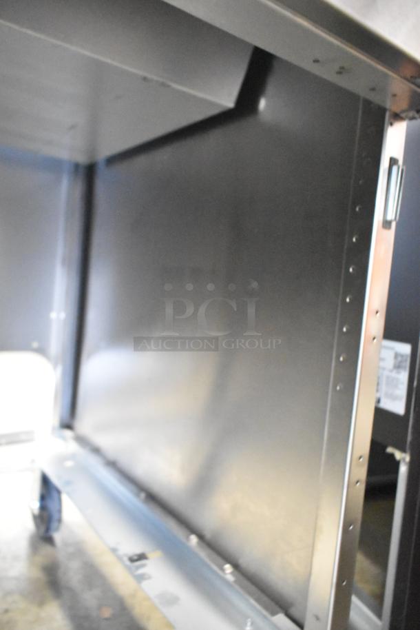 Frymaster stainless steel commercial dump station on casters; new with minor scratches and dents visible.