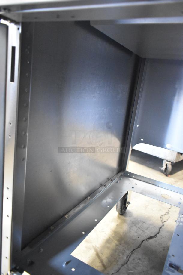 Frymaster stainless steel dump station on casters, brand new with some scratches and dents, commercial floor style.