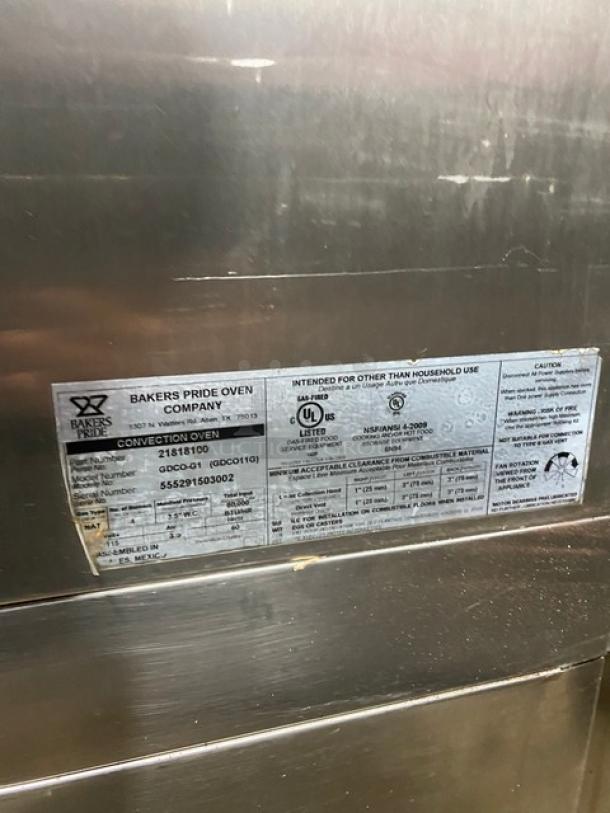 Bakers Pride GDCO-G1 commercial stainless steel double convection oven with thermostatic controls, SN: 555291503002, on casters.