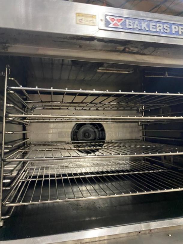 Bakers Pride Cyclone Series GDCO-G1 commercial stainless steel double-stacked convection oven. Natural gas, thermostatic controls, on casters.