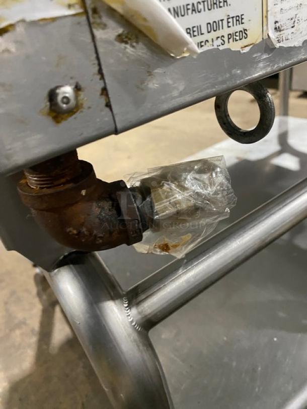WoodStone stainless steel gas countertop plancha griddle on equipment cart, SN: GP1B16MAY1704992, shown with attached conduit.