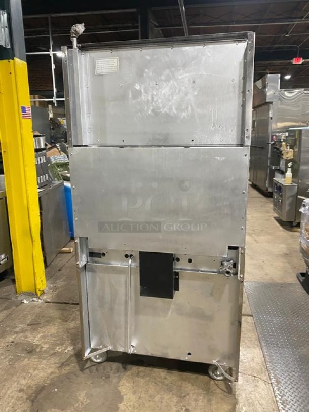 Garland SunFire Series 6 Burner Range/Oven Combo with Salamander Broiler, Model SX626, on casters, stainless steel.