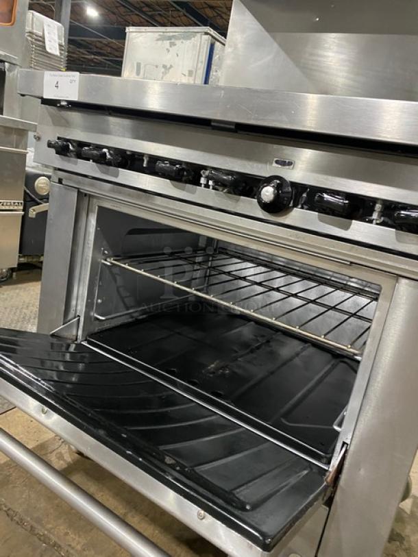 Garland SunFire Series commercial stainless steel 6-burner range/oven combo with salamander broiler, model SX626, on casters.