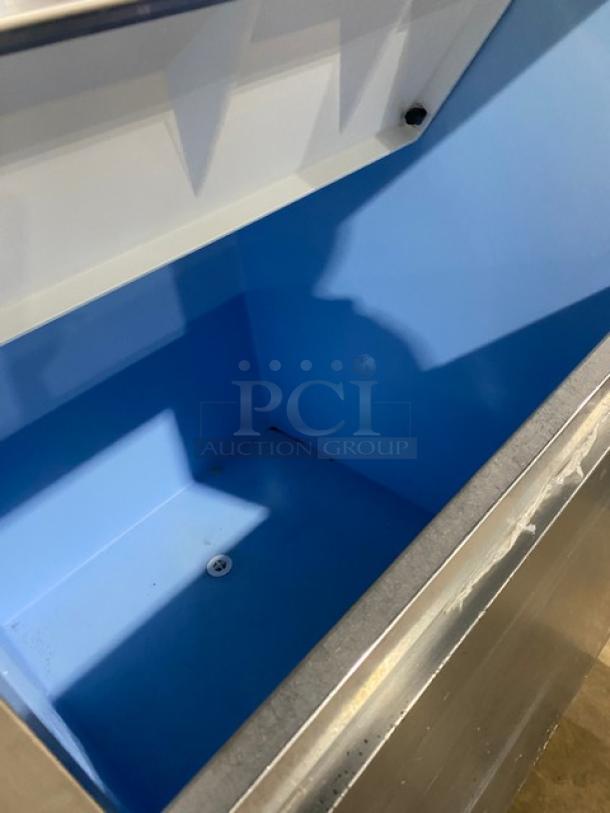 Hoshizaki KM-1340MRJ/B-500PF ice machine bin interior, stainless steel, electric, modular, 208-230V, on legs.