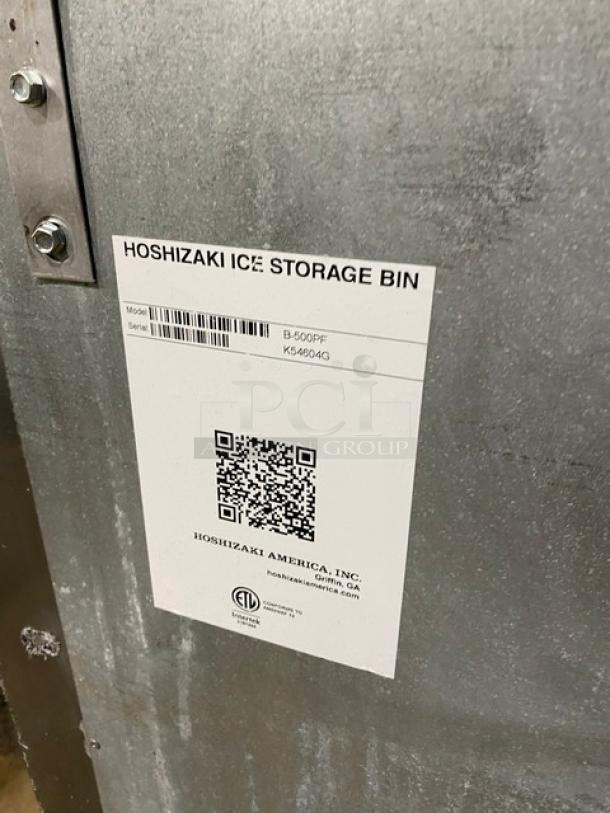 Hoshizaki ice maker label with model KM-1340MRJ/B-500PF, serial numbers, and QR code. Stainless steel exterior.
