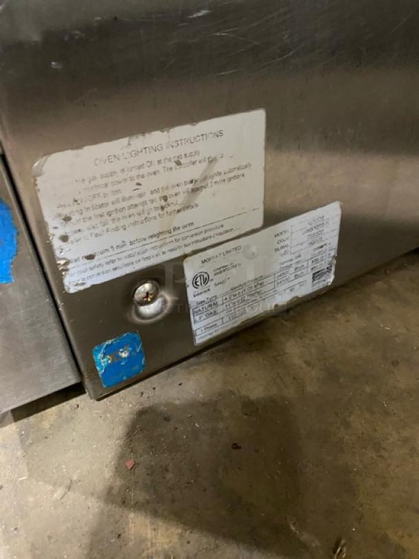 Moffat TurboFan G32D5 gas convection oven, stainless steel, with built-in pan slide and blue gas connector hose, serial number 755326.