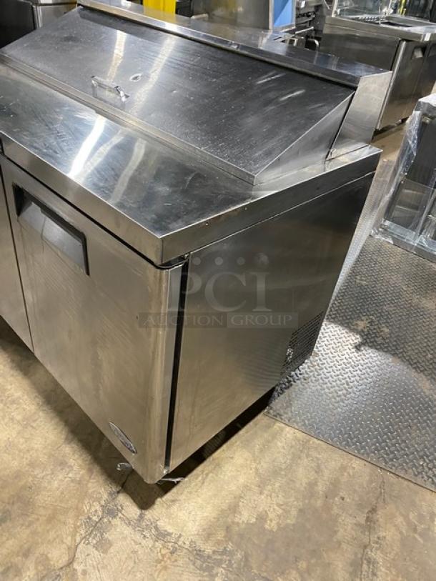 Atosa Commercial Stainless Steel 2-Door Prep Table, Model MSF8302, with poly-coated wired rack, on casters, SN: MSF8302150621C4003.