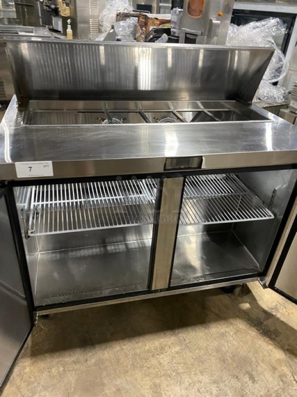 Atosa stainless steel 2-door refrigerated prep table, model MSF8302, with bain marie top and poly-coated rack, on casters.