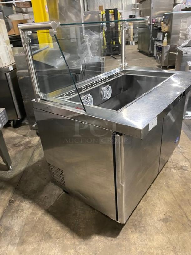 Atosa MSF8306 stainless steel salad/sandwich prep table with sneeze guard, poly-coated rack, and casters. 2-door, 115V.