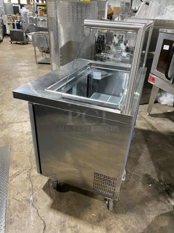 Atosa Commercial Stainless Steel 2 Door Refrigerated Prep Table Model MSF8306 with sneeze guard, poly rack, on casters.
