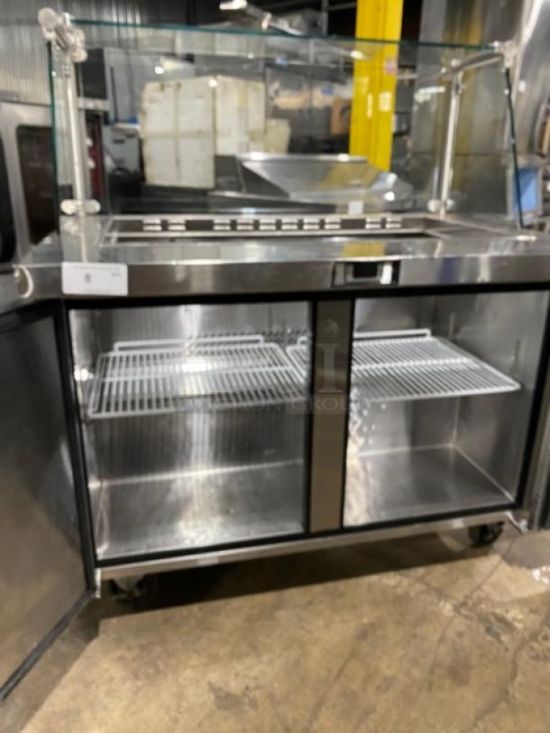 Atosa MSF8306 stainless steel 2-door refrigerated prep table with sneeze guard, poly-coated wire rack, on casters.