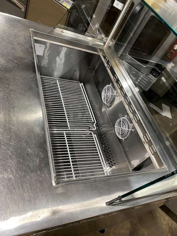 Atosa MSF8306 stainless steel 2-door refrigerated prep table with sneeze guard, poly-coated rack, and casters. 115V.