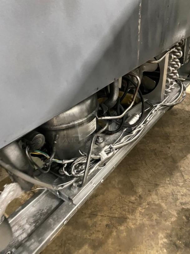 Interior view of Atosa MSF8306 prep table showing wiring and compressor. Suitable for commercial kitchen use.