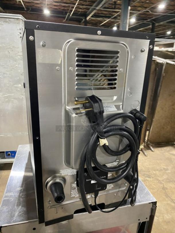 MerryChef Eikon E2S high-speed rapid cook oven, black, electric, 208/240V 1-phase, back view with power cord.