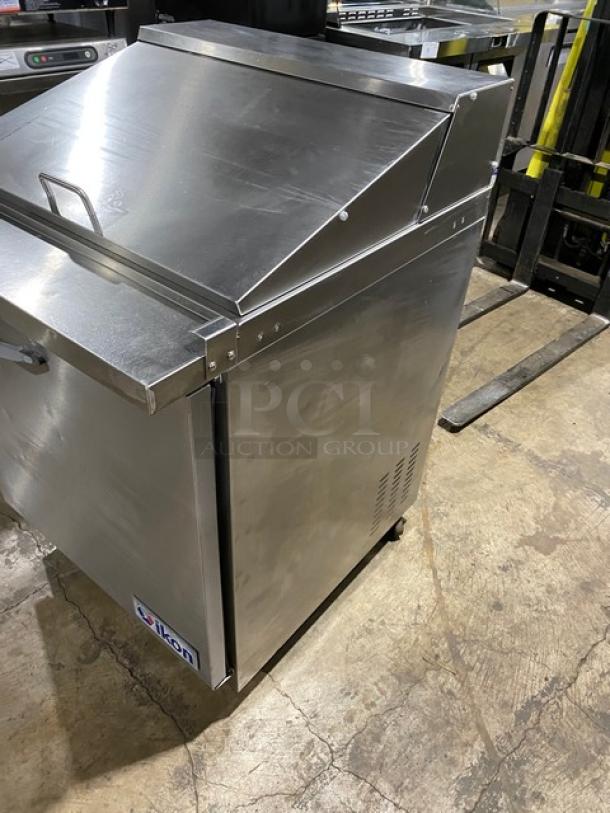 Ikon stainless steel single door refrigerated prep table, Model ISP29M, with poly-coated rack, on casters, 115V, in good condition.