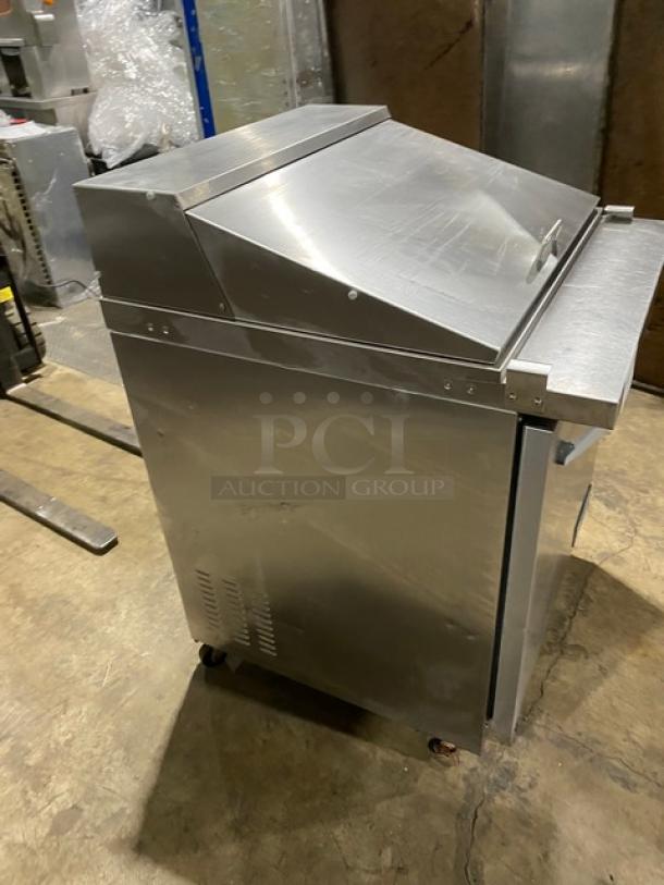 Ikon stainless steel refrigerated prep table, model ISP29M, with poly coated rack, single door, on casters, 115V.