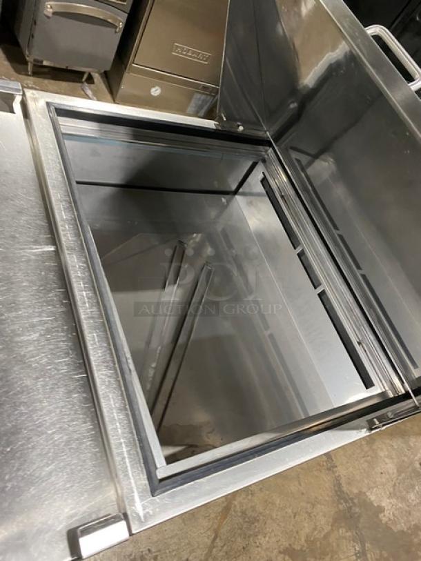 Ikon ISP29M single door refrigerated prep table, stainless steel, Bain Marie style, poly coated rack, 115V, on casters.