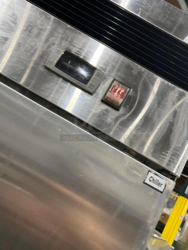 US Refrigeration USBV48R commercial stainless steel 2-door refrigerator. Features poly coated wired rack. Model USBV-48R, SN US2014VA403, 115V 1 Phase. "Chiller" label visible.