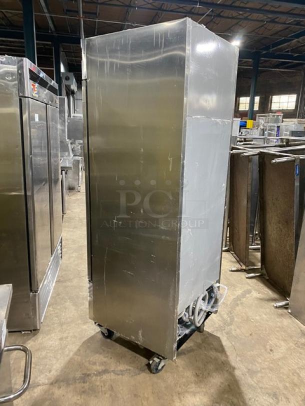 Norlake single door stainless steel reach-in refrigerator, model TR231SSS0, on casters, with poly-coated wire rack.